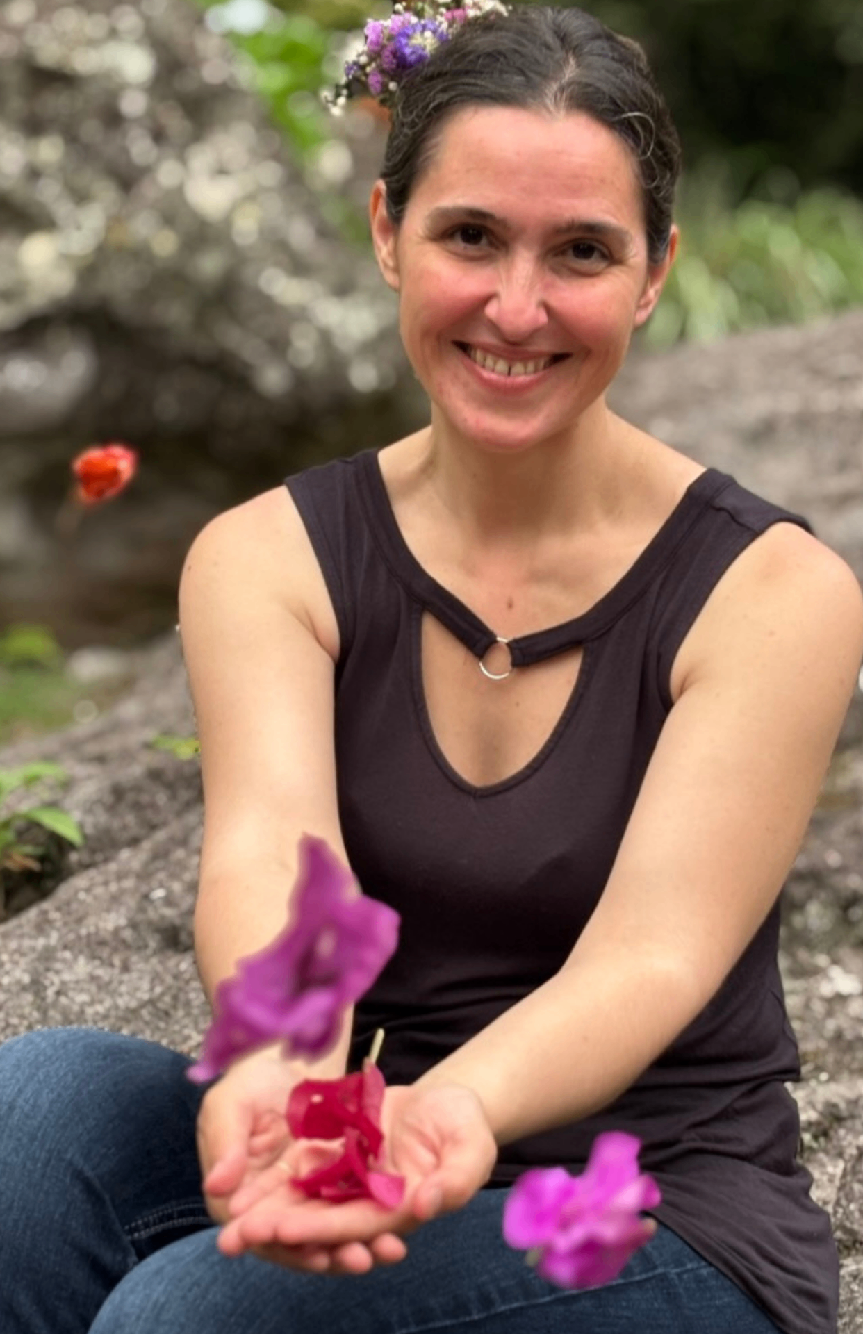 Christene offering flower petals, a symbol of receptive presence